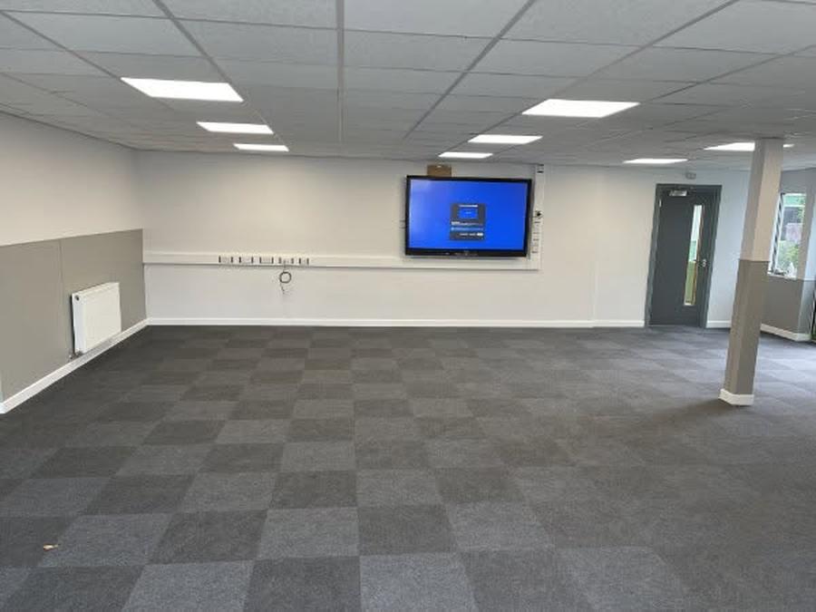 Breakout room with wall-mounted display screen