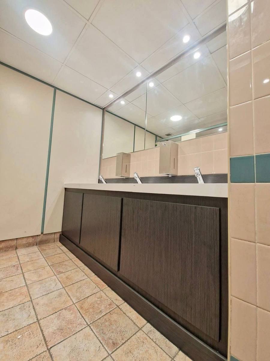 Commercial washroom with vanity lighting